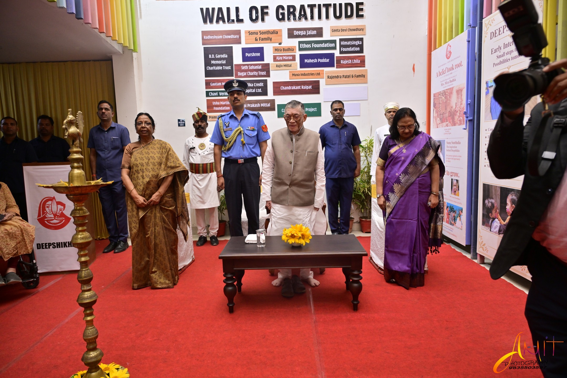 The Governor lighting the lamp at the Wall of Gratitude