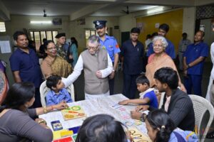 Craft workshop table (paper, ribbons, rakhis)