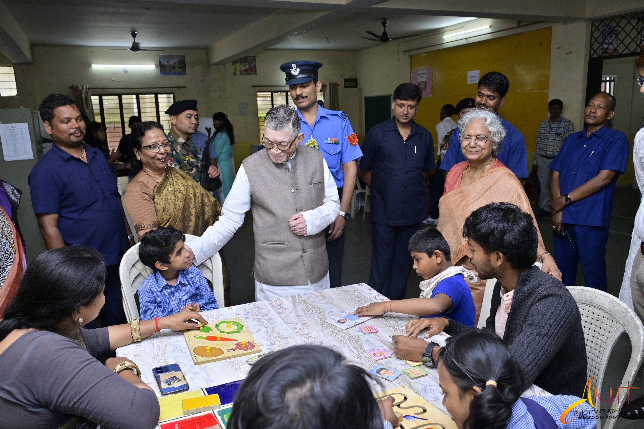 The Governor meeting children at a learning table at Deepshikha